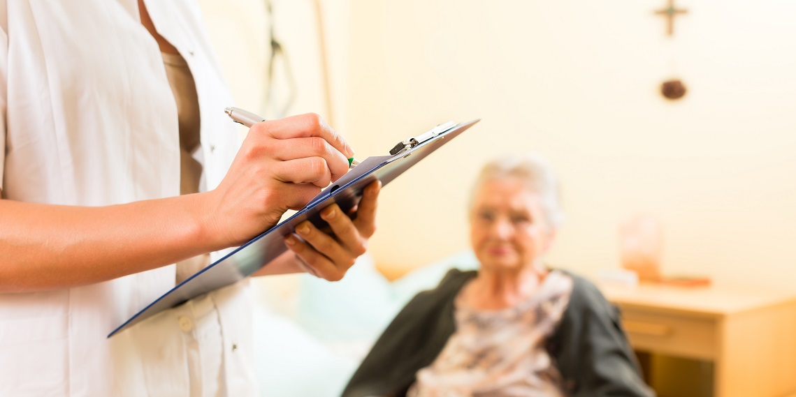 Long-Term Care Compliance Young nurse and female resident